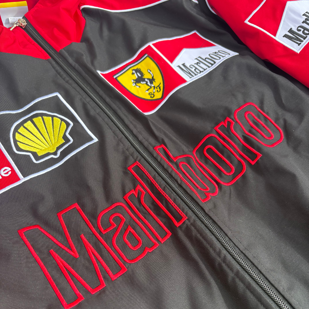 Ferrari F1 racing jacket with Marlboro and Shell logos, red and black design from revnhaus
