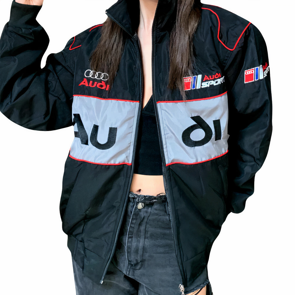 Black Audi Sport racing jacket with red trim and logo patches, styled for motorsport fans from revnhaus