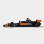 Orange and black F1-style LEGO race car model from revnhaus