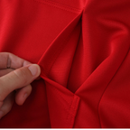 Close-up of red racing jacket fabric and stitching detail from revnhaus