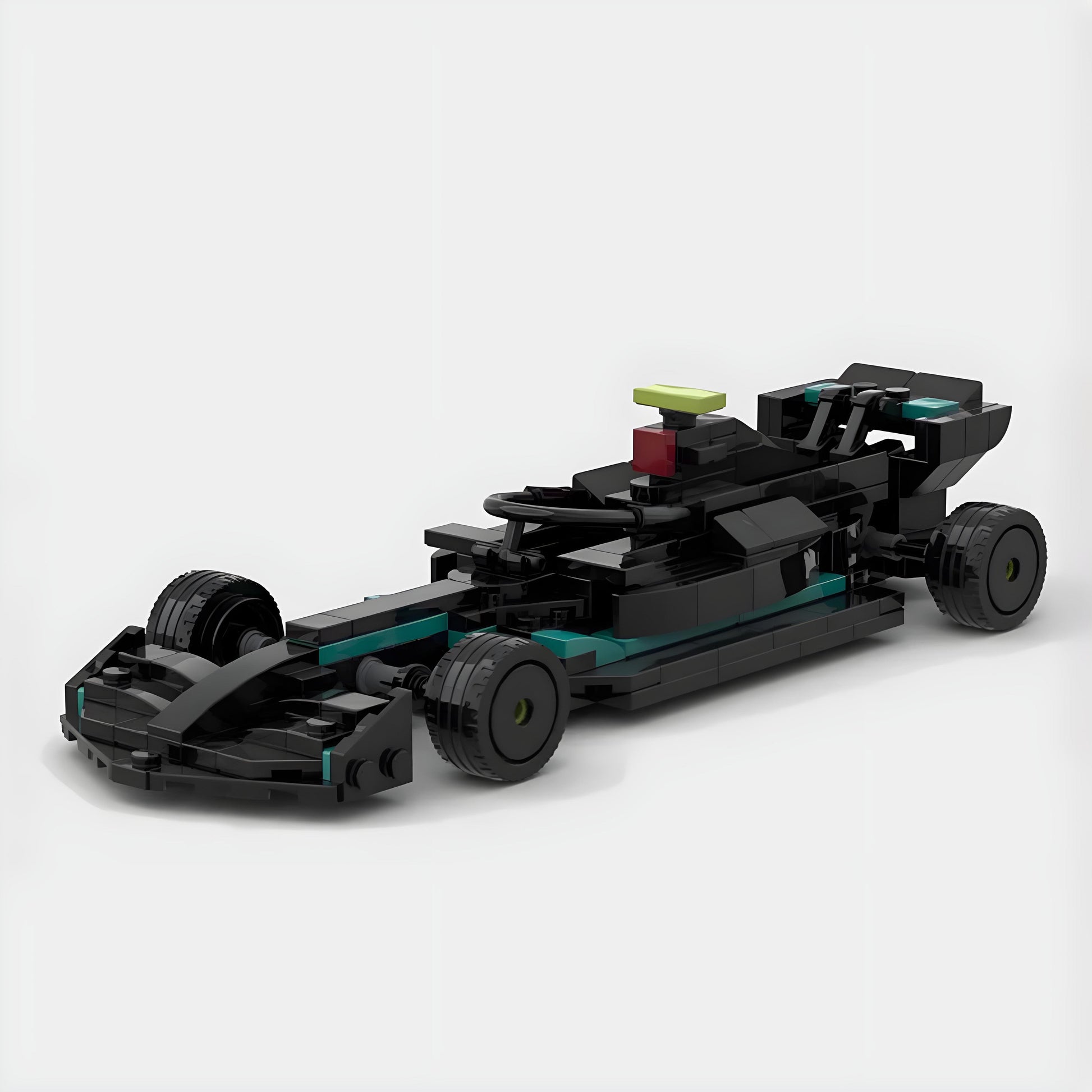 Black and teal LEGO-style F1 race car model with open cockpit and rear wing, from revnhaus