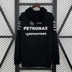 Black Mercedes-AMG Petronas F1 hoodie with CrowdStrike logo, hanging on hanger from revnhaus