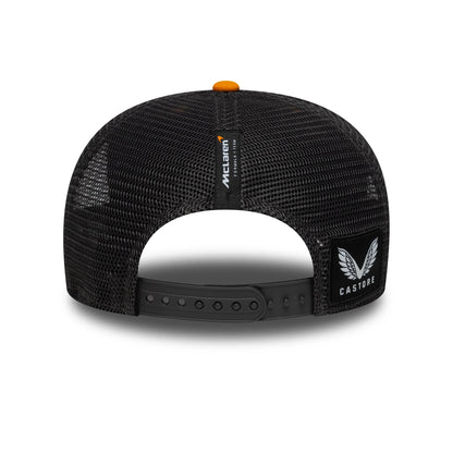 Black McLaren Castore trucker hat with mesh back and orange button, from revnhaus