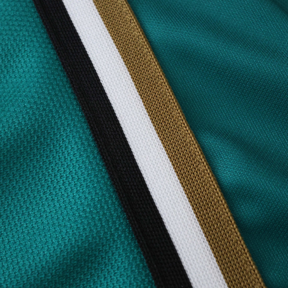 Teal motorsport jacket with black, white, and gold stripes from revnhaus