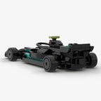 Black and teal LEGO-style F1 race car model with exposed chassis from revnhaus