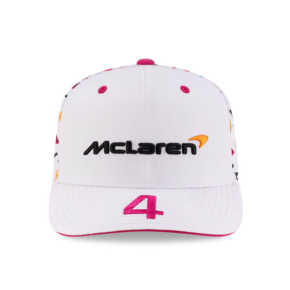 White McLaren racing cap with pink #4 and colorful graphics from revnhaus