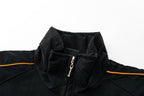 Black motorsport racing jacket with orange trim and zipper detail from revnhaus
