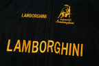 Black Lamborghini racing jacket with gold embroidered logo and text from revnhaus
