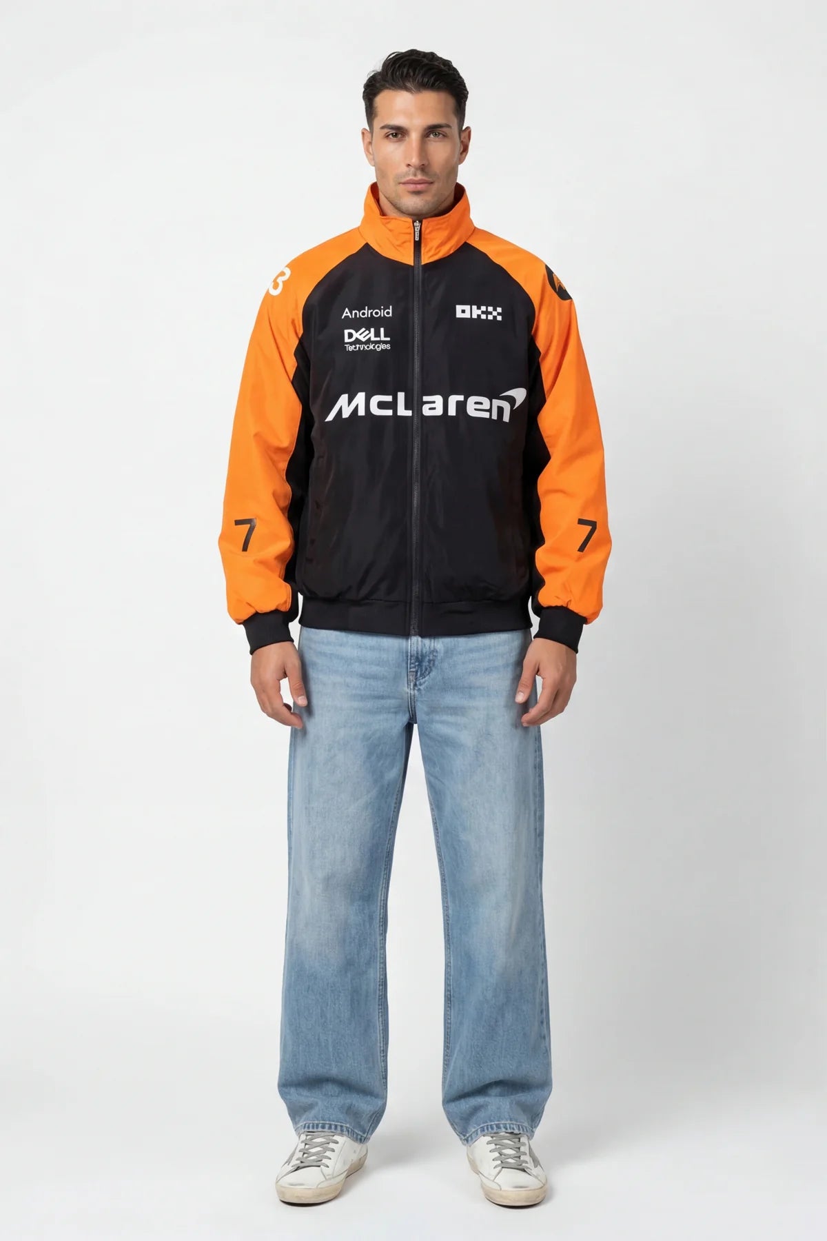 Man wearing McLaren racing jacket with orange sleeves and sponsor logos from revnhaus