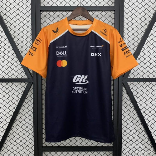 McLaren F1 team racing jersey with sponsor logos, orange and navy design from revnhaus