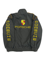 Black Porsche racing jacket with yellow logo and 'MIND' sleeves, from revnhaus