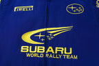 Blue Subaru World Rally Team jacket with yellow Pirelli and Subaru logos from revnhaus