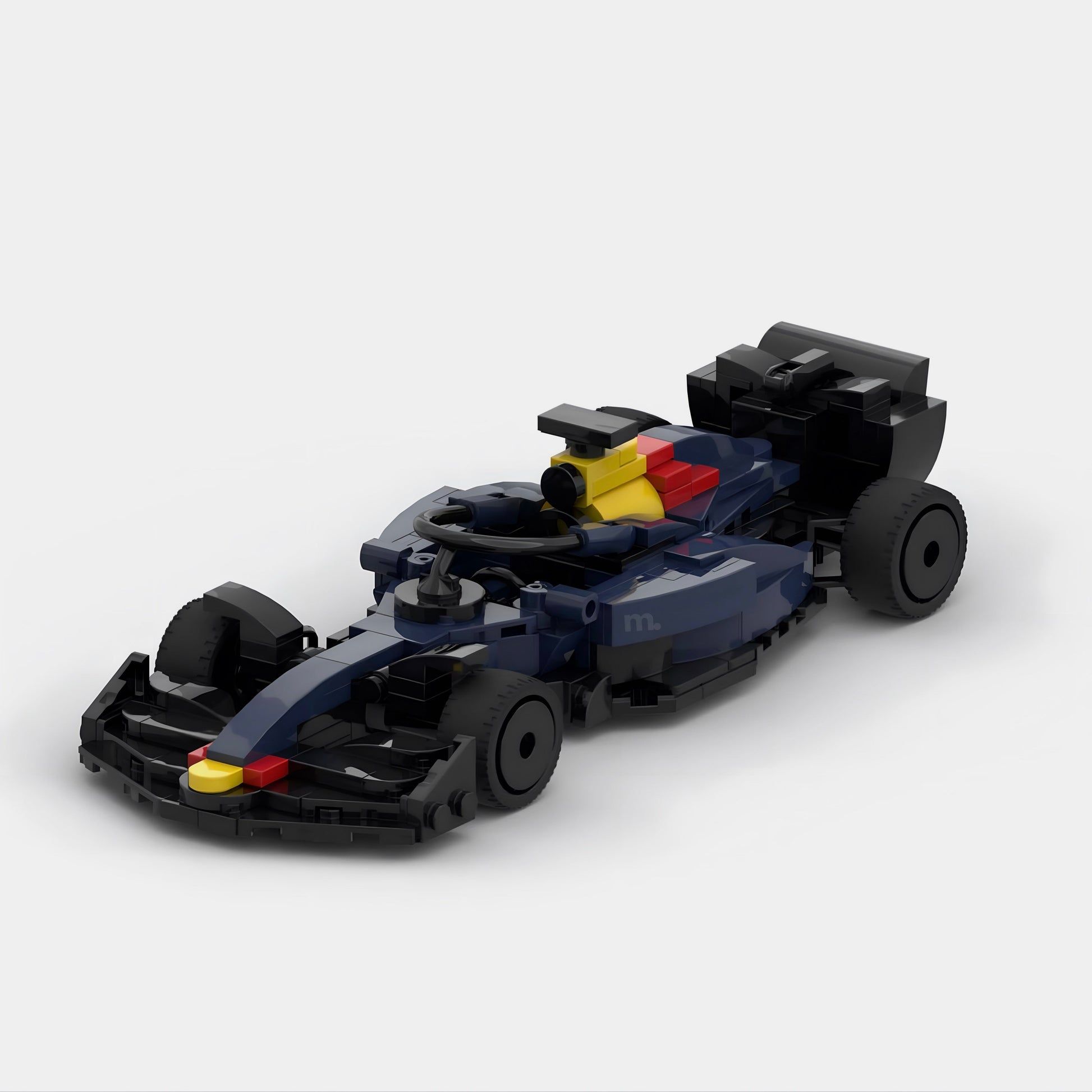 Blue and black LEGO-style F1 race car with yellow driver, die-cast collectible from revnhaus