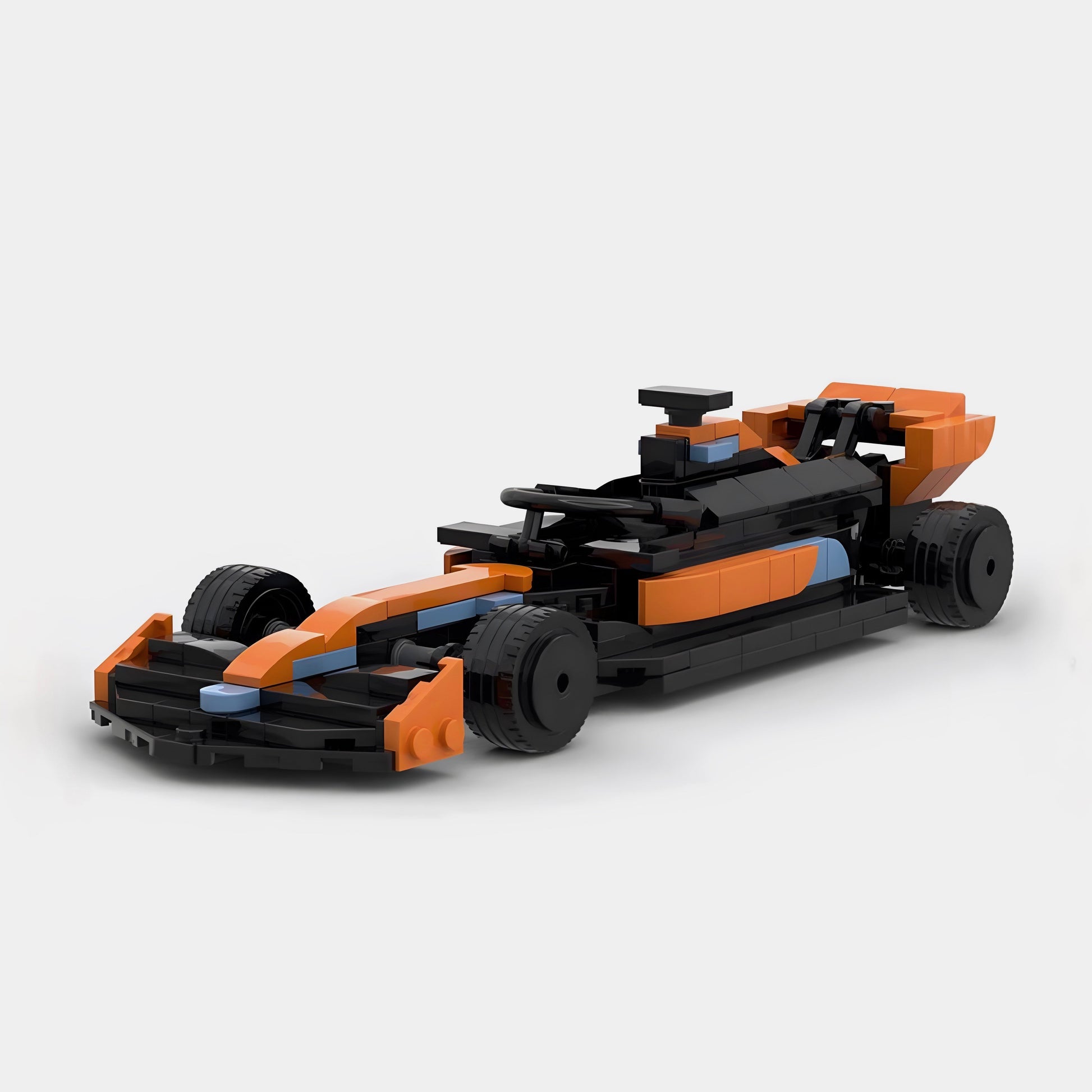 Orange and black LEGO-style F1 race car model with blue accents from revnhaus