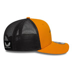 Orange and black trucker hat with mesh back and winged logo, from revnhaus