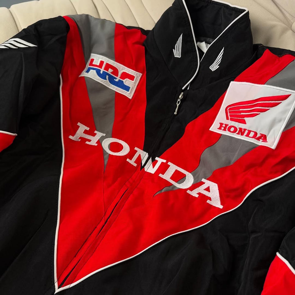 Honda HRC racing jacket with red, black, and gray design from revnhaus