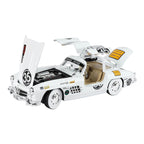 White AMG 300 SL die-cast model car with open doors, hood, and trunk, detailed engine and interior from revnhaus