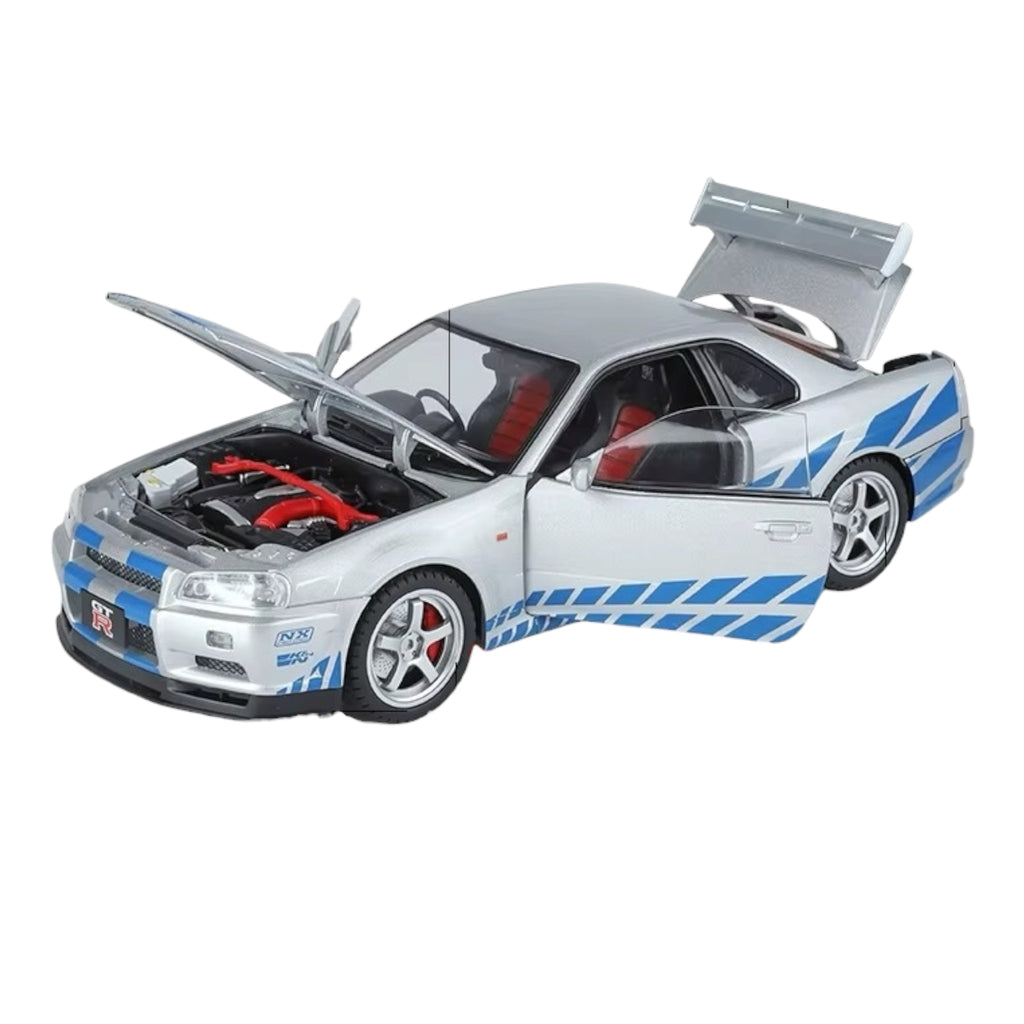 Silver Nissan GT-R die-cast model with blue stripes, open hood & doors, red interior from revnhaus