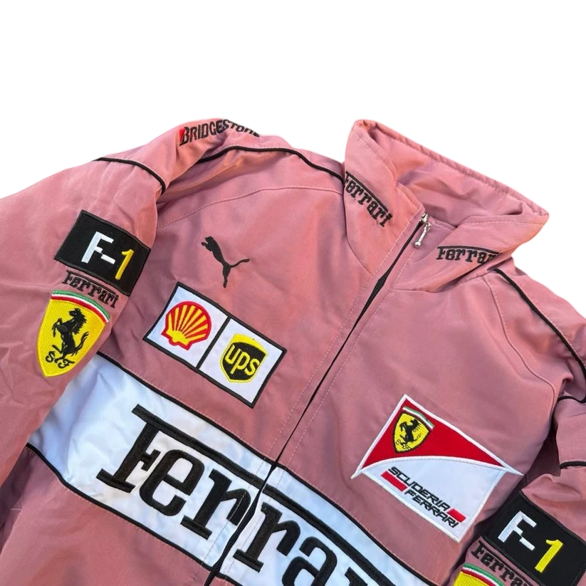 Pink Ferrari F1 racing jacket with Shell, UPS, and Scuderia patches from revnhaus