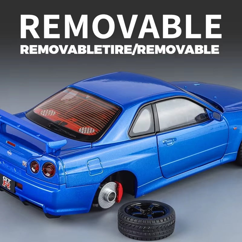 Blue Nissan GT-R die-cast model with removable tire, motorsport collectible from revnhaus