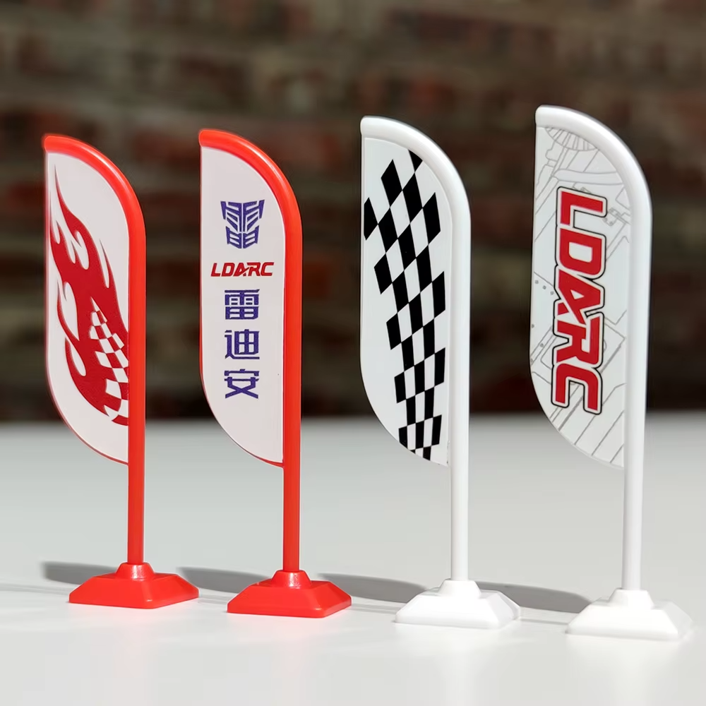 Mini RC racing flags with flame, checkered, and LDARC logos from revnhaus