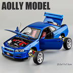 Blue die-cast Nissan GT-R model car with open doors, hood, and trunk, detailed engine from revnhaus