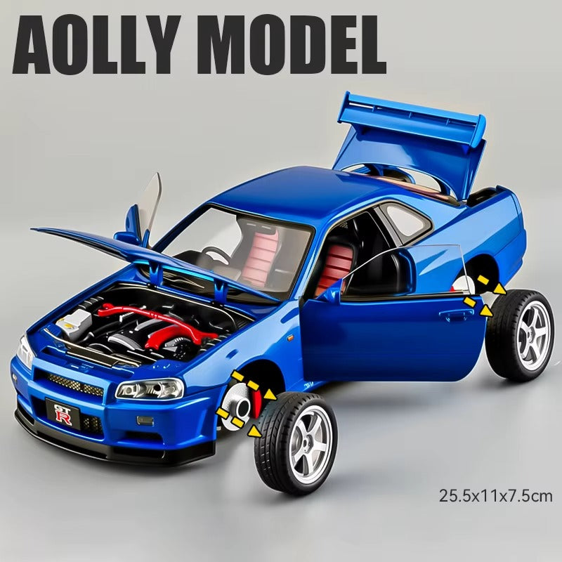 Blue die-cast Nissan GT-R model car with open doors, hood, and trunk, detailed engine from revnhaus