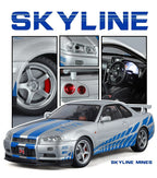 Silver Nissan Skyline GT-R die-cast model with blue racing stripes and detailed interior from revnhaus