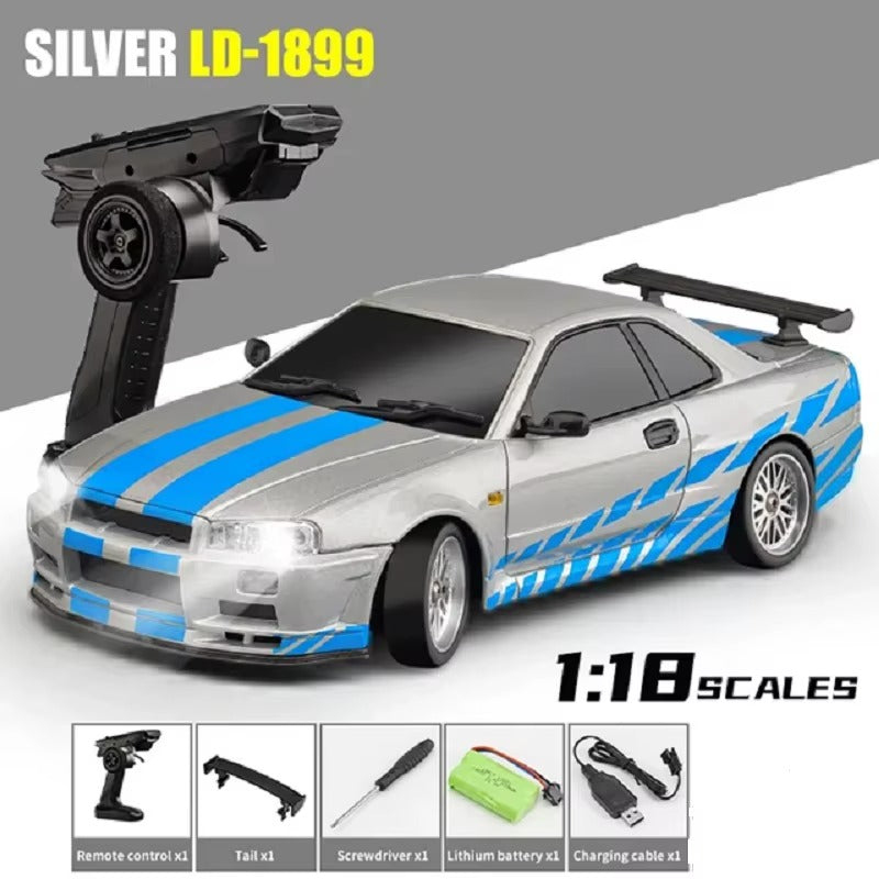 Silver 1:18 scale RC drift car with blue stripes and remote control from revnhaus
