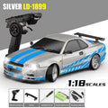 Silver 1:18 scale RC drift car with blue stripes and remote control from revnhaus