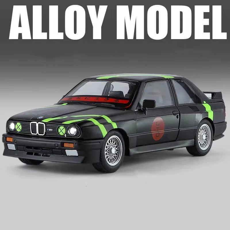 Black BMW E30 M3 alloy model car with green racing stripes and red accents from revnhaus