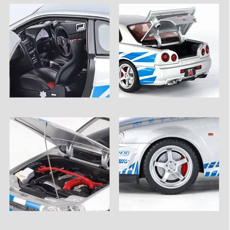 Silver Nissan Skyline GT-R die-cast model with blue stripes, detailed interior, engine, and rear spoiler from revnhaus