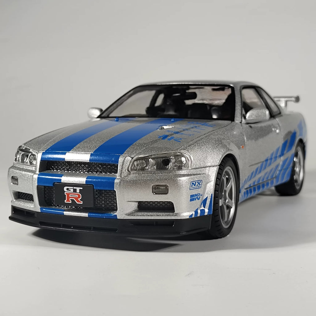 Silver and blue Nissan GT-R die-cast model car with racing decals from revnhaus