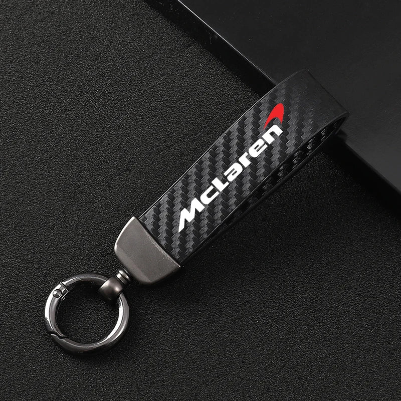 McLaren carbon fiber keychain with red logo, sleek automotive accessory from revnhaus