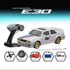 White Monster E30 RC drift car with remote, racing wheels, and accessories from revnhaus