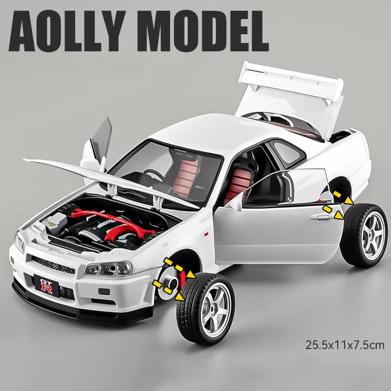 White Nissan GT-R die-cast model with open doors, hood, and trunk, red engine details, from revnhaus