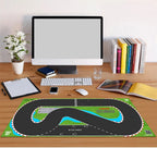 Racing track desk mat with RC circuit design, green grass and blue water details from revnhaus