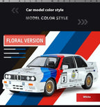 BMW M3 E30 die-cast model car in floral livery with Warsteiner decals, white base from revnhaus