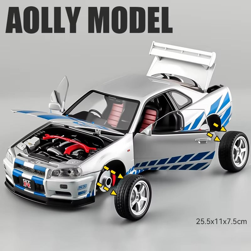 Silver GT-R die-cast model car with open doors, hood, and trunk, blue racing stripes, from revnhaus