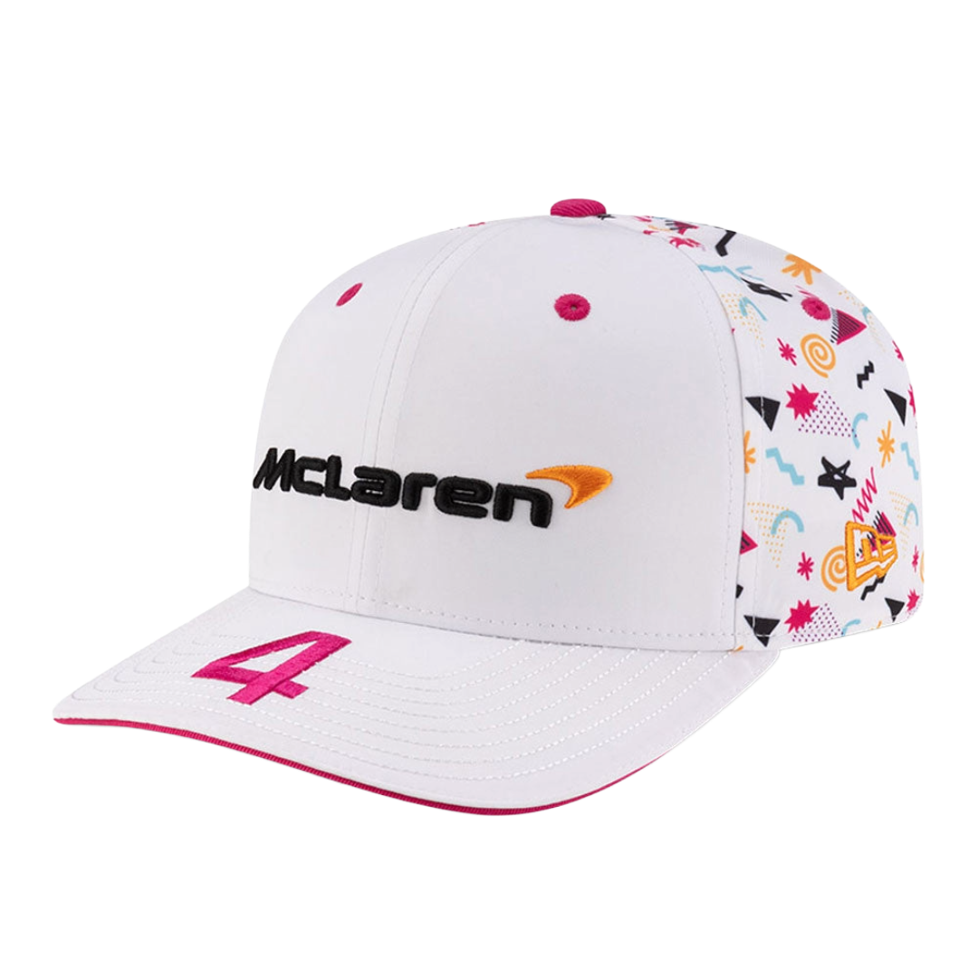 White McLaren F1 racing cap with colorful geometric patterns and pink number 4, from revnhaus