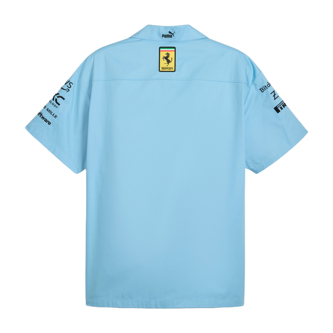 Light blue Puma Ferrari racing shirt with sponsor logos on sleeves from revnhaus