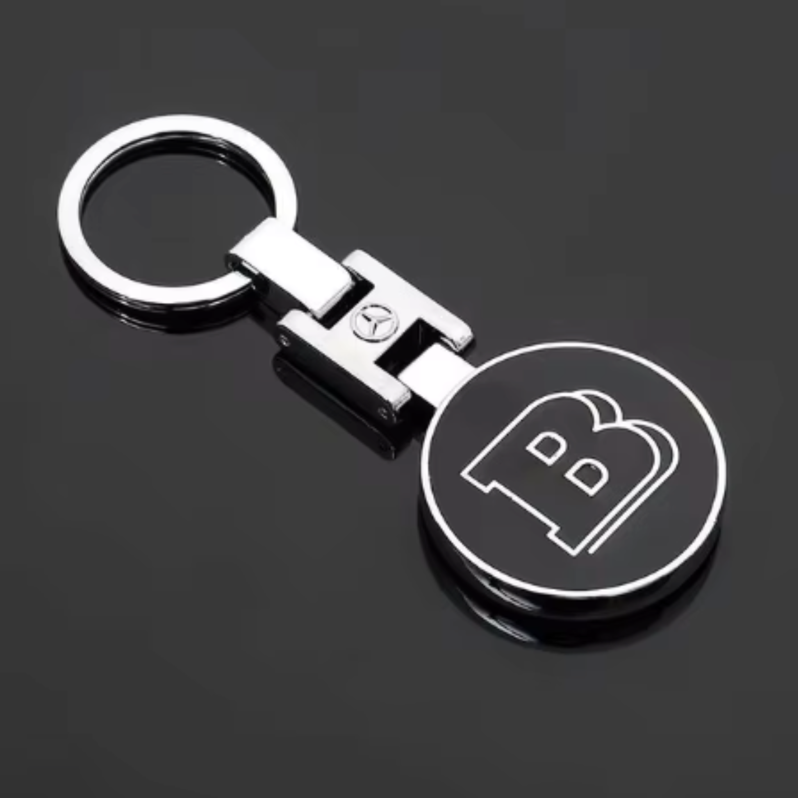 Mercedes-Benz logo keychain with sleek black and silver design from revnhaus