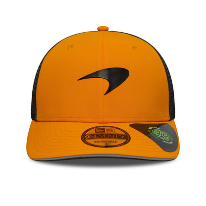 Orange and black trucker hat with sleek logo, adjustable fit from revnhaus