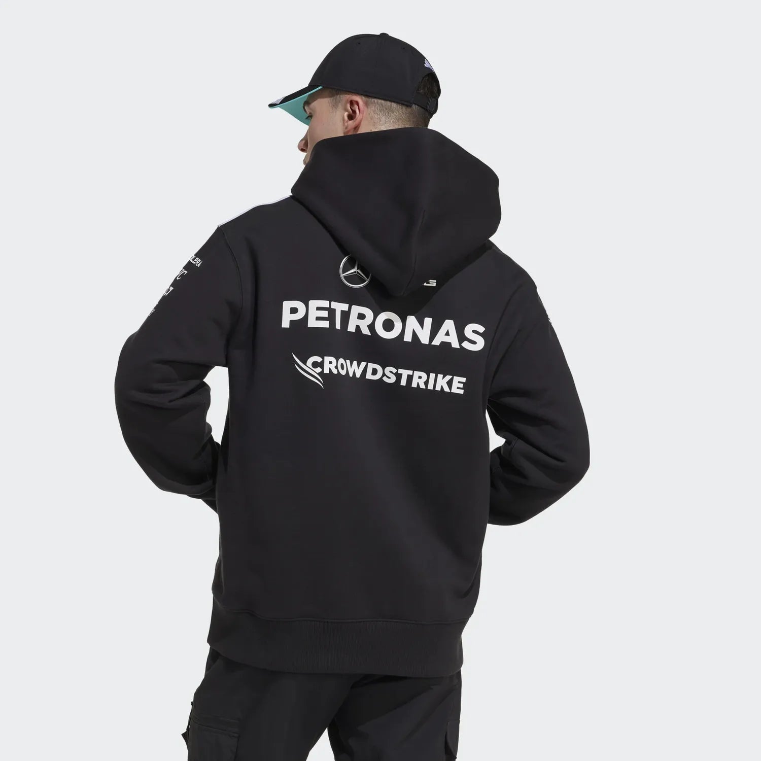 Black Petronas Mercedes F1 hoodie with CrowdStrike logo, worn with cap from revnhaus