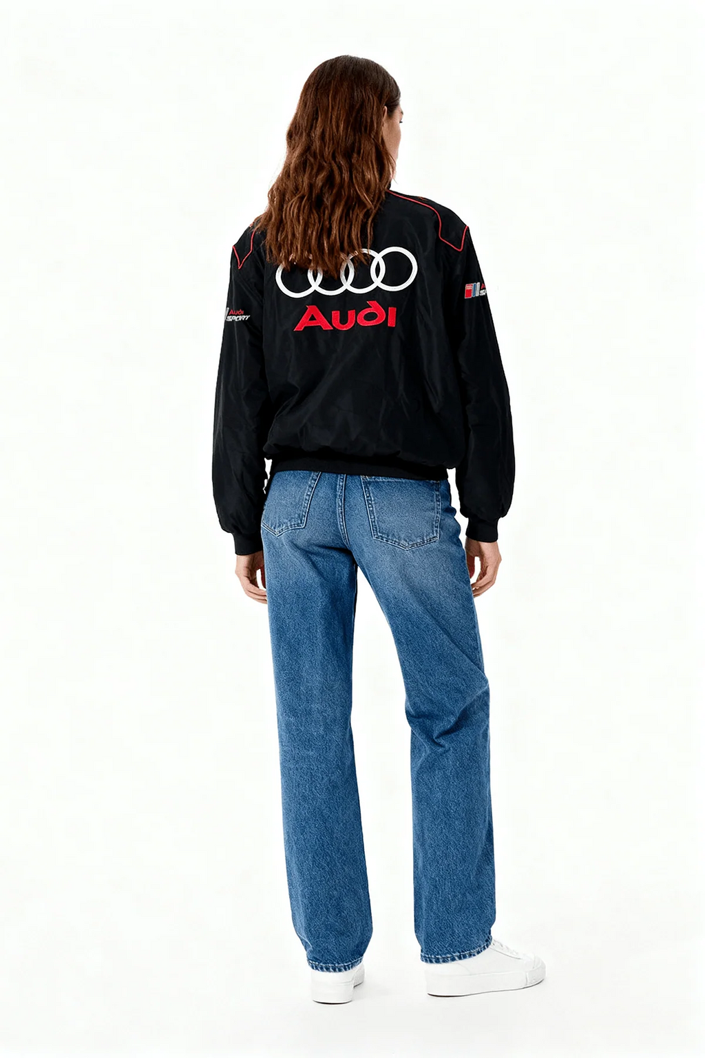 Black Audi Sport racing jacket with logo, worn with jeans and white sneakers from revnhaus