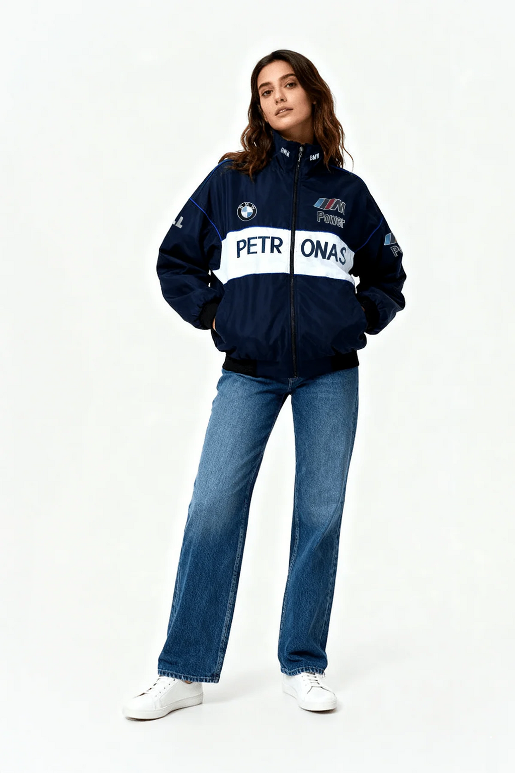 Woman in navy BMW M Power Petronas racing jacket and jeans from revnhaus