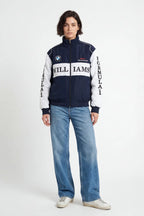 Williams F1 racing jacket with BMW logo, navy and white, worn with jeans from revnhaus