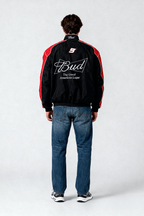 Black and red racing jacket with Bud logo and number 9 on back, worn with jeans from revnhaus