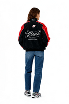 Black and red racing jacket with Bud logo and number 9, worn by woman in jeans from revnhaus