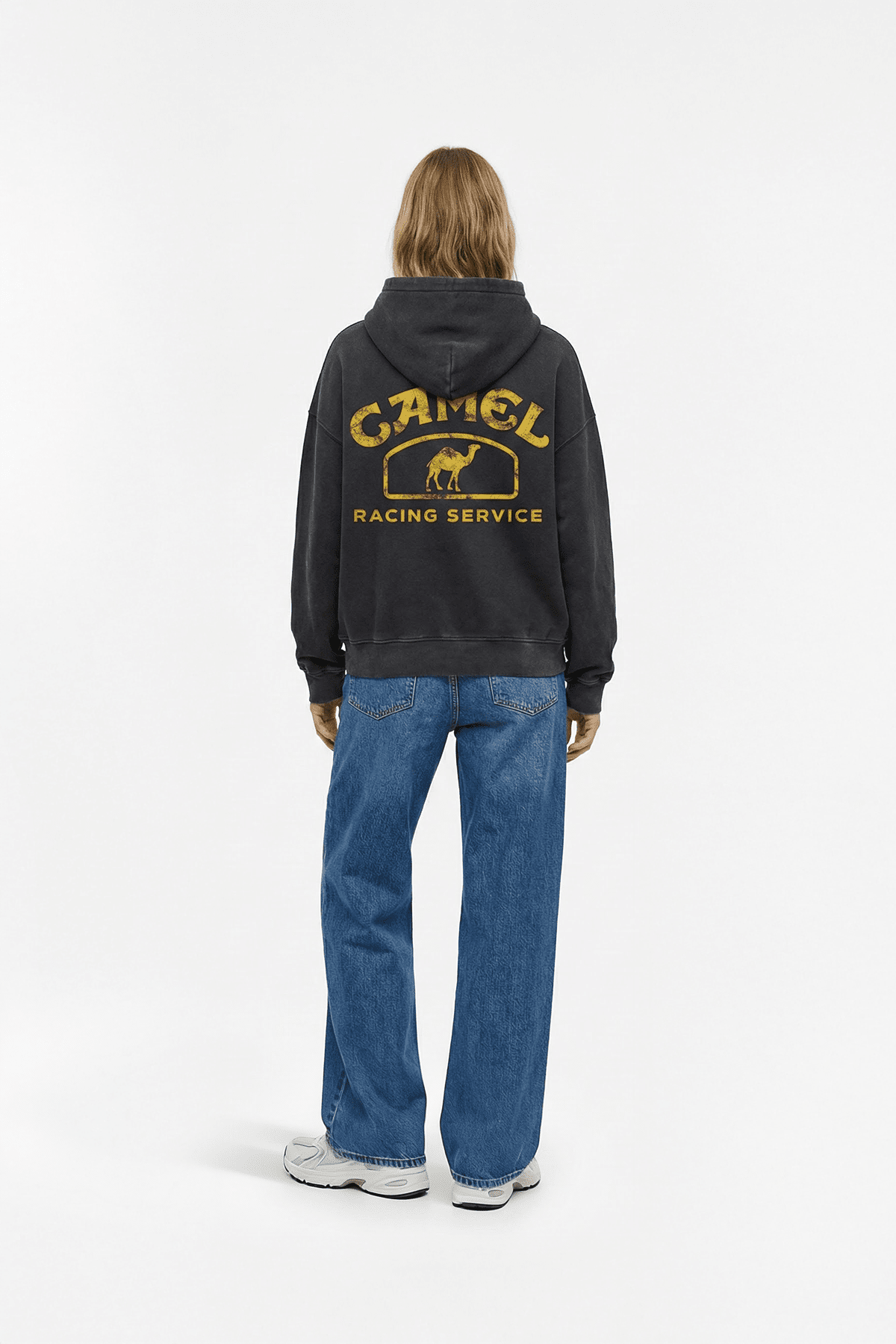 Black hoodie with vintage Camel Racing Service graphic on back, worn with jeans from revnhaus